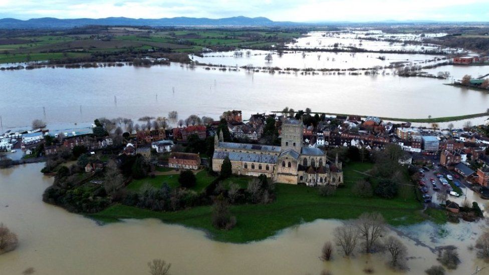 An aerial view of Tewkesbury showing the Abbey surrounded by flood water