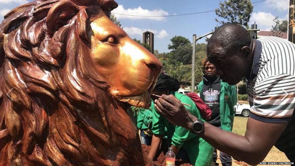Lion sculpture getting finishing touches by artist