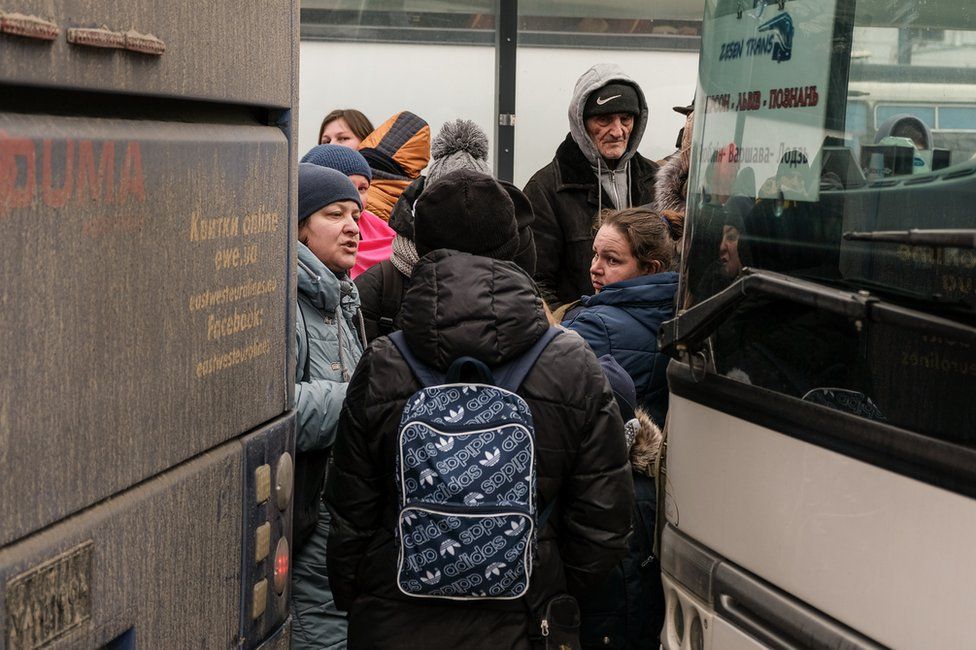 Poland's government began sending buses over the weekend to bring refugees over the border to safety.