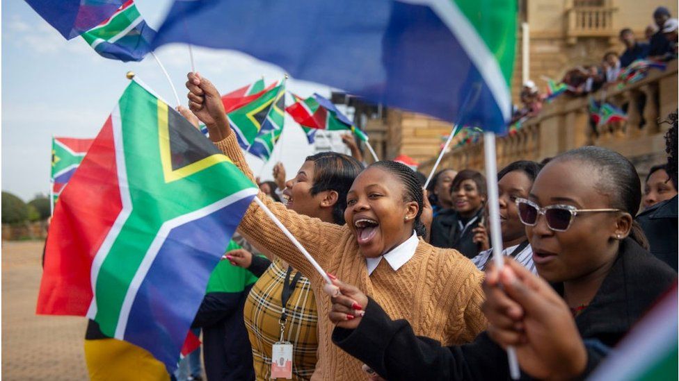 Women with South Africa flags celebrating at the Union Buildings in Pretoria, South Africa - Wednesday 27 July 2022