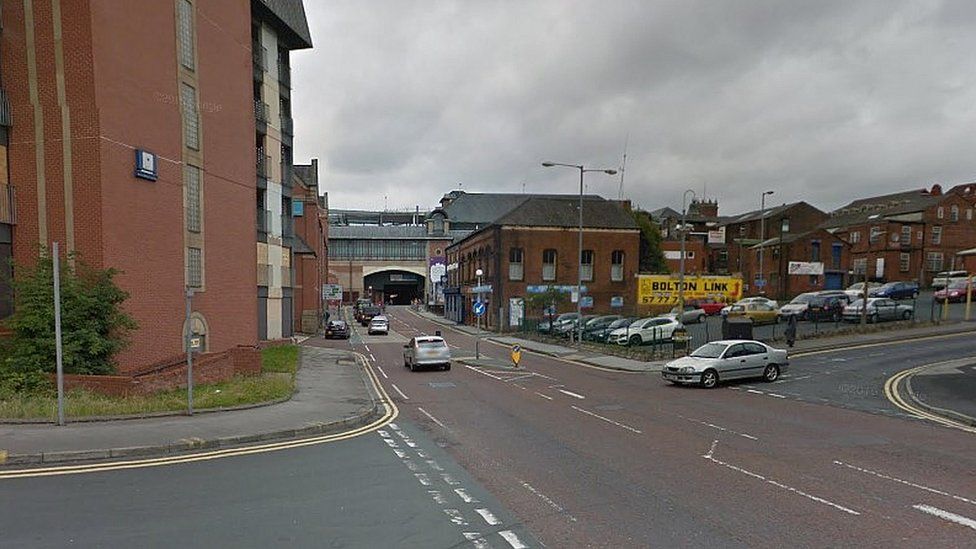 Woman who fell backwards in Bolton street killed by car - BBC News