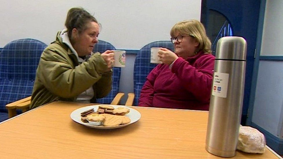 Joanne Wiig and Ann Randall with a hot drink at the community centre