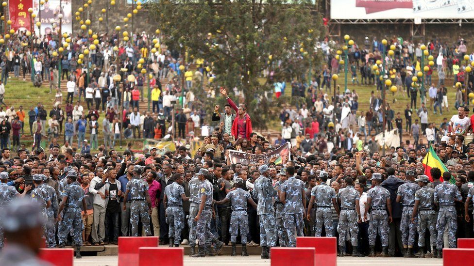 Ethiopians attend the burial ceremony of Simegnew Bekele