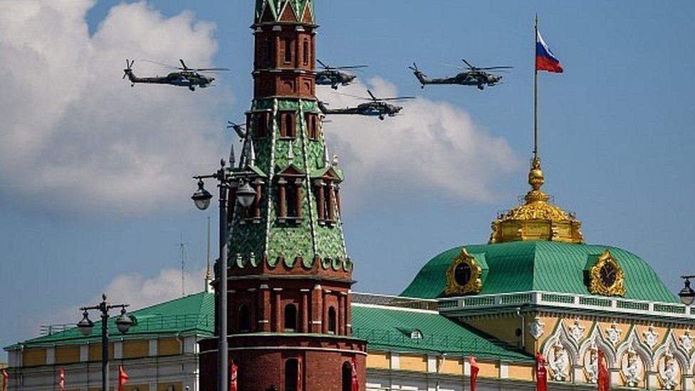 Russian helicopters fly past the Kremlin