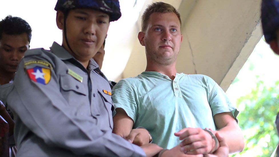 Dutch citizen Klaas Haytema is escorted into a Myanmar court where he was sentenced to three months in prison for interfering with a religious observance, in Mandalay, Myanmar