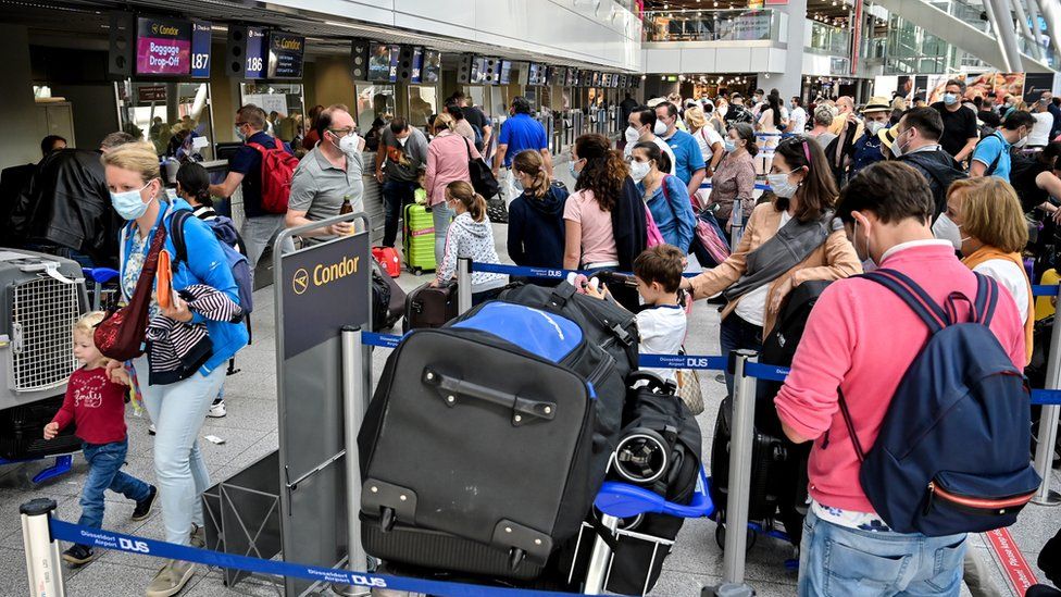 Travellers in the departure area of the international airport in Dusseldorf