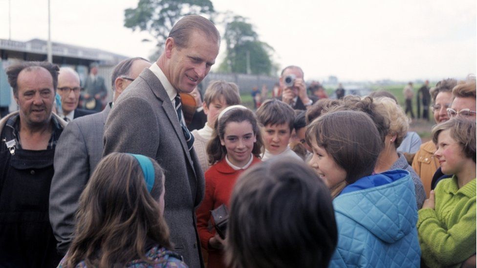 The Duke of Edinburgh talking to children during an impromptu visit to the Scottish National Caravan Rally in 1969