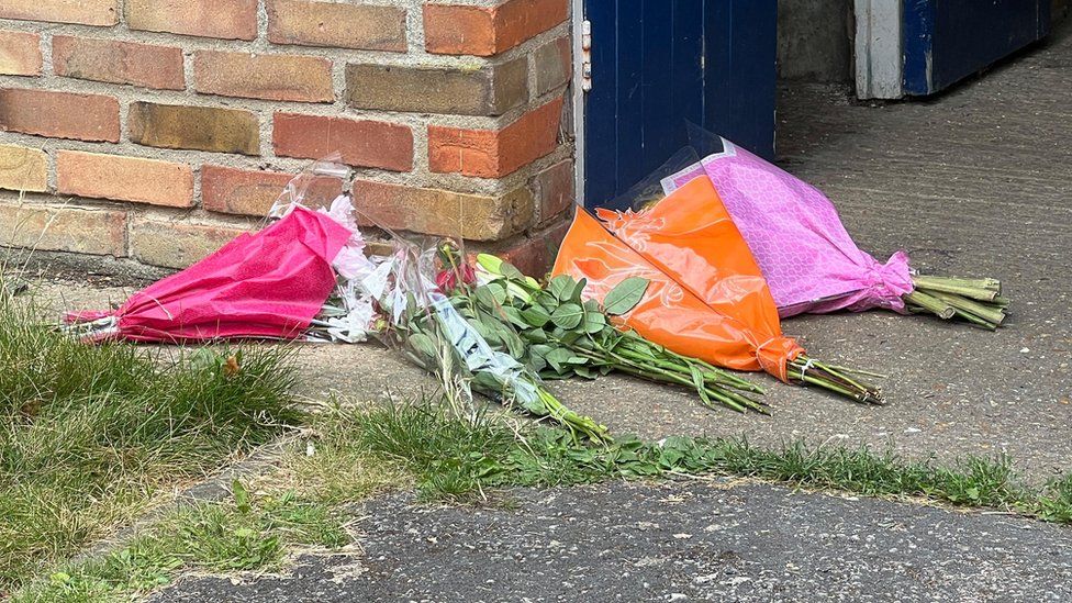 Flower at the scene of a fatal fire in Cambridge