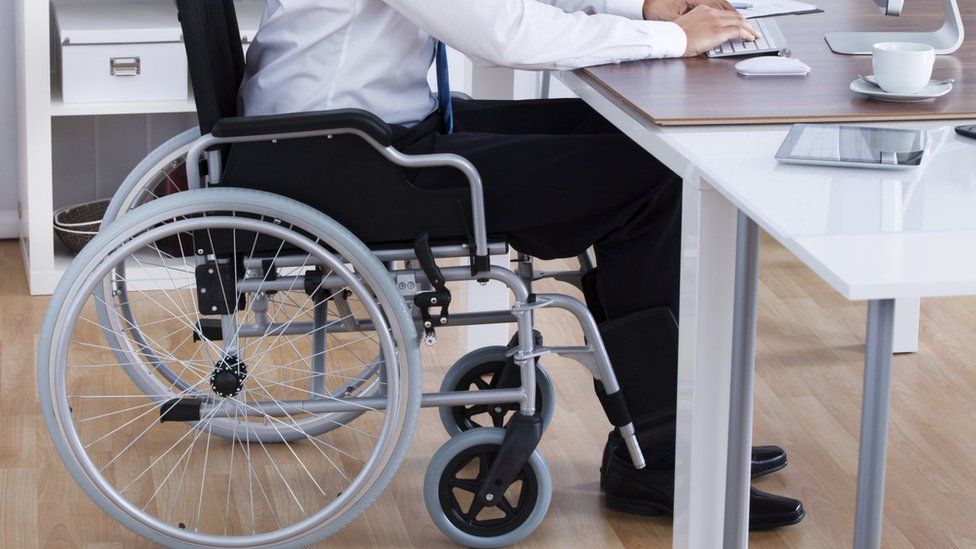 Disabled man at desk