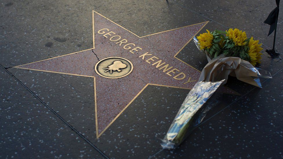 Flowers on George Kennedy's star on the Hollywood Walk of Fame