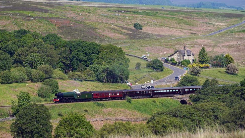 The Royal train pulled by the Flying Scotsman in celebration of its 100th anniversary