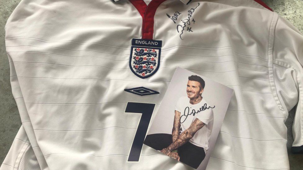 David Beckham signed photograph and England shirt.