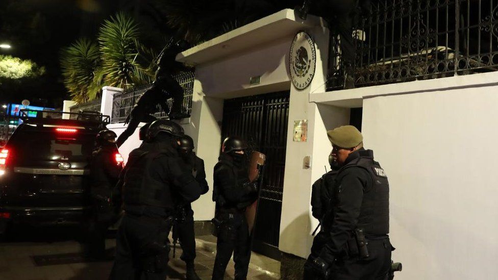 Police outside the entrance to the Mexican embassy in Quito