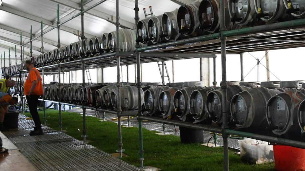 Beer barrels lined up at the festival bar