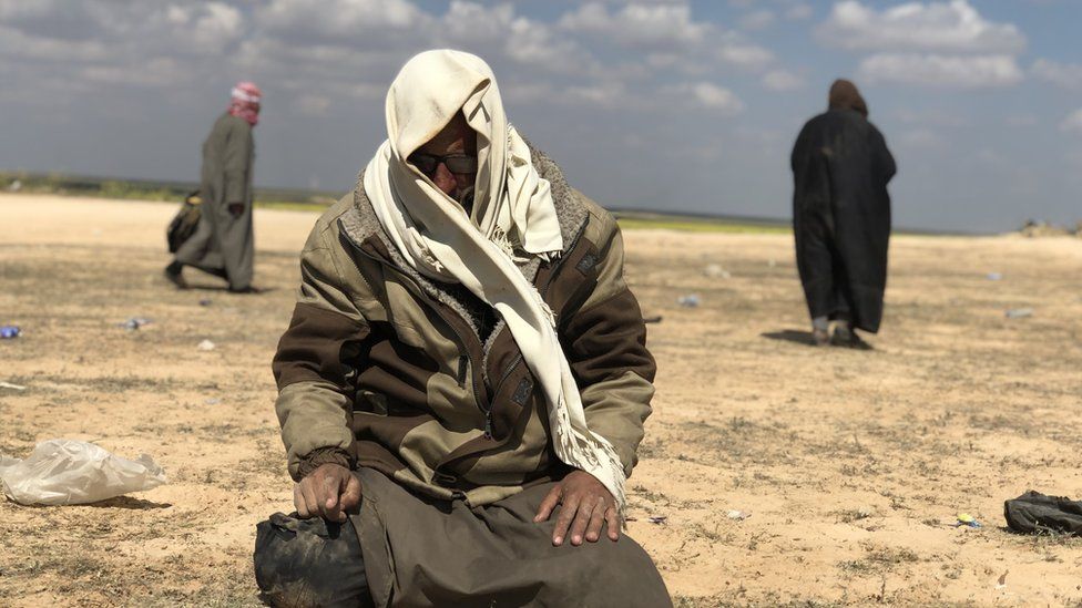 Man sits in the desert