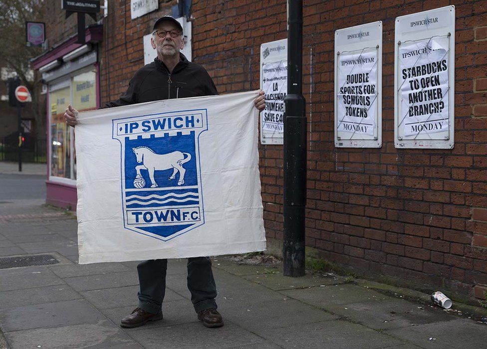 Andrew Kerrison with his home-made banner
