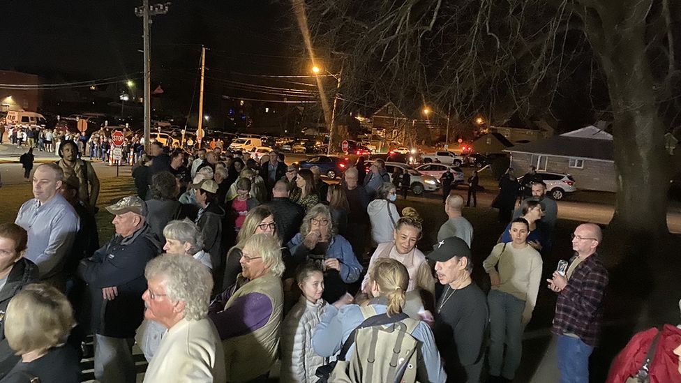 Residents gathering outside a town hall meeting in Ohio