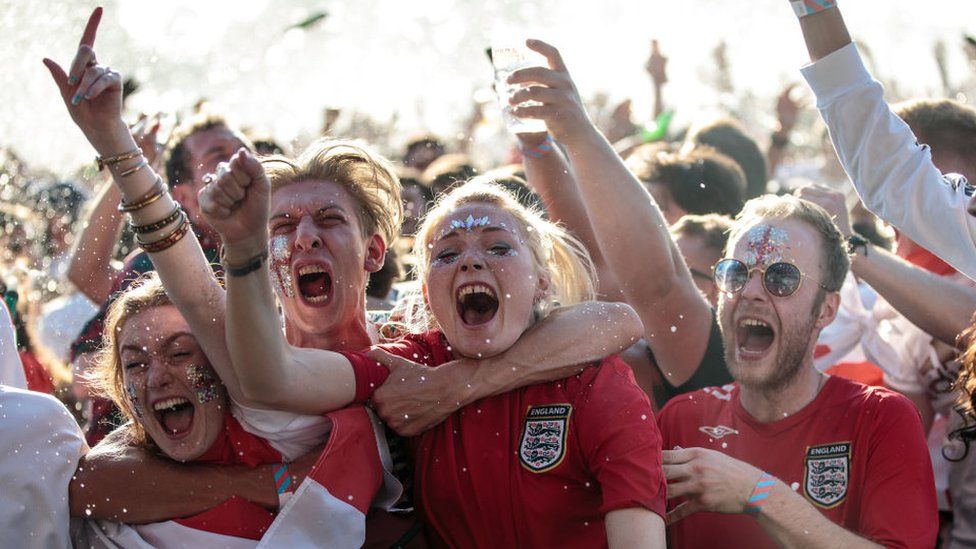 England fans celebrating the team's performance in the World Cup