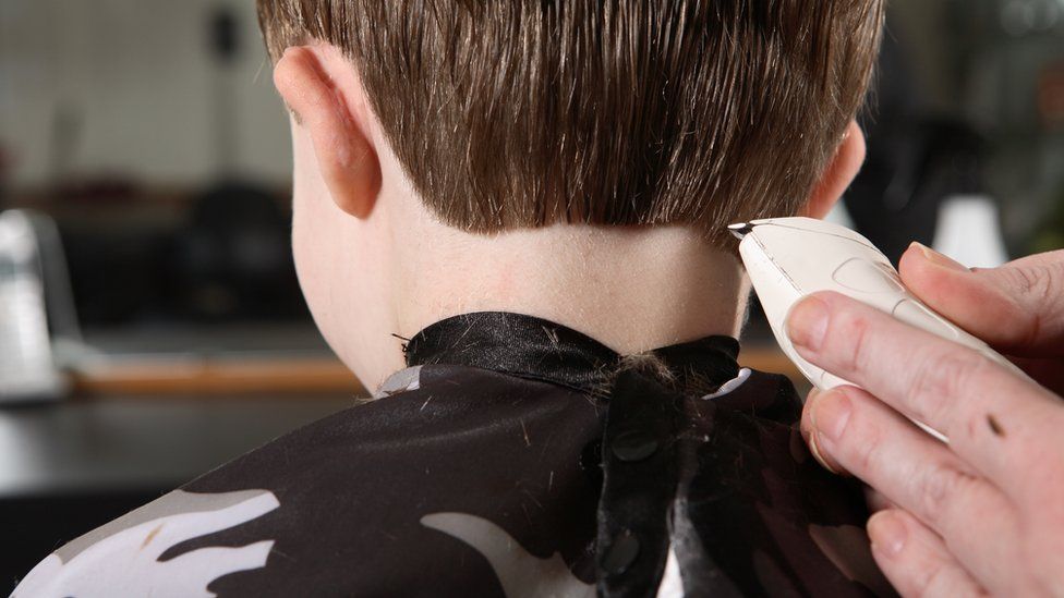 Child having a hair cut