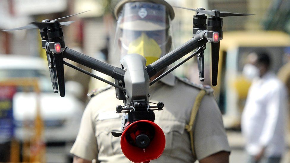 A drone being used by police to monitor activities of people