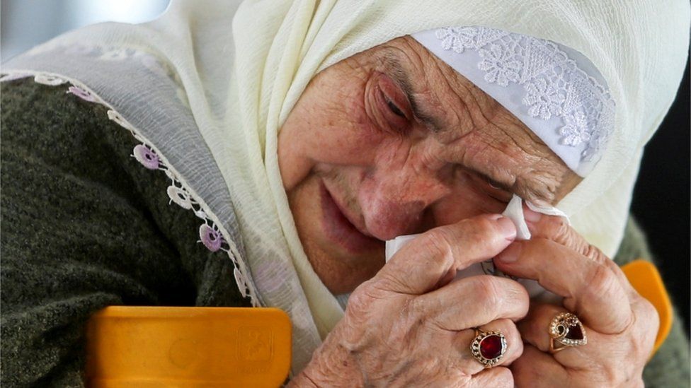 A Bosnian Muslim woman reacts as she awaits the final verdict of former Bosnian Serb military leader Ratko Mladic