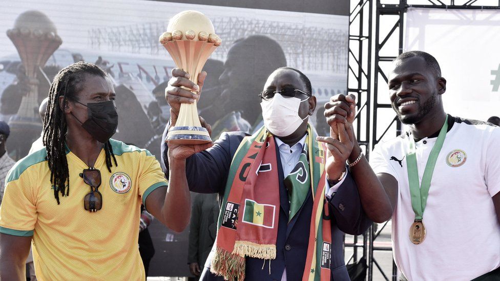 Team welcomed home by President