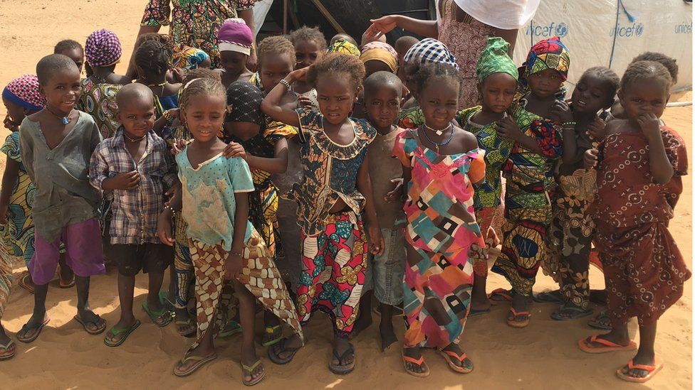 Children displaced by Boko Haram insurgency outside their makeshift school run by Unicef in a camp in Niger's Diffa region