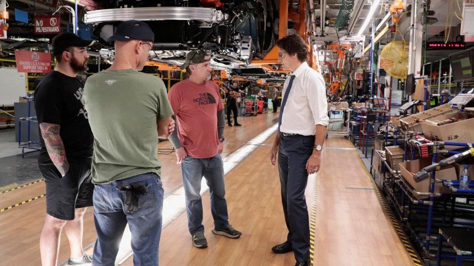 Prime Minister Justin Trudeau speaks with auto assembly workers