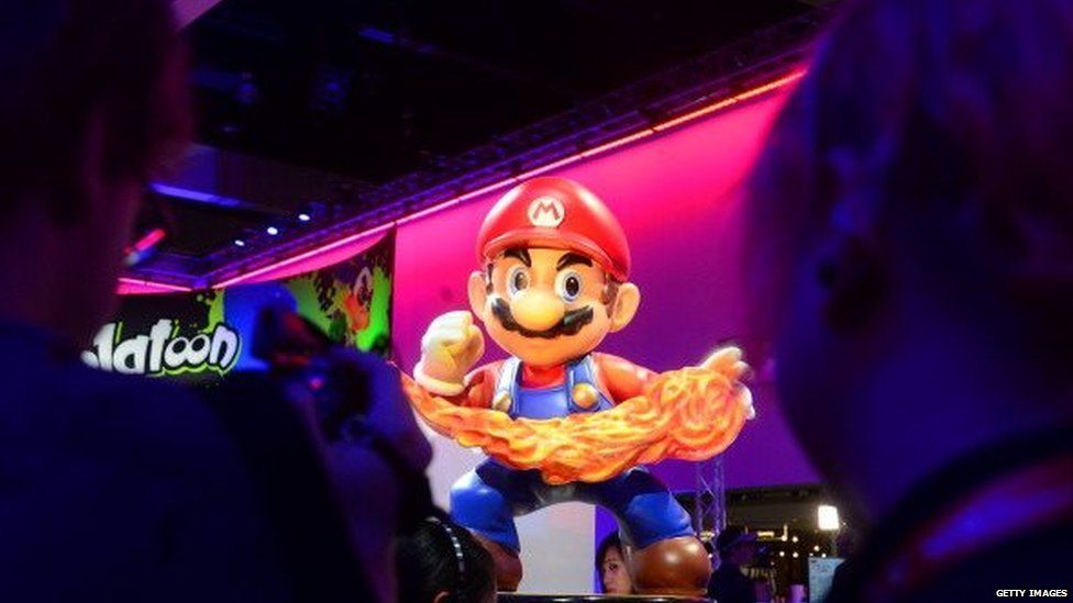 A Super Mario display at the Nintendo section attracts attention at the annual E3 video game extravaganza in Los Angeles, California on June 10, 2014