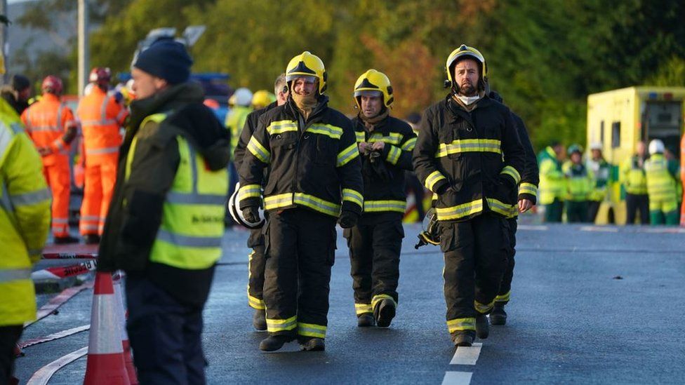 firemen at scene of Creeslough incident