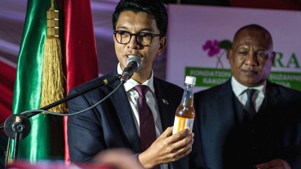 President of Madagascar Andry Rajoelina shows a "Covid Organics", a herbal medicine, which allegedly being developed against coronavirus (Covid-19), during a press conference in Antananarivo, Madagascar on April 20, 2020.