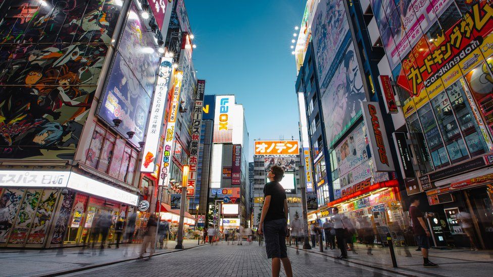 Young man at Akihabara electric town, street view, Tokyo, Japan.