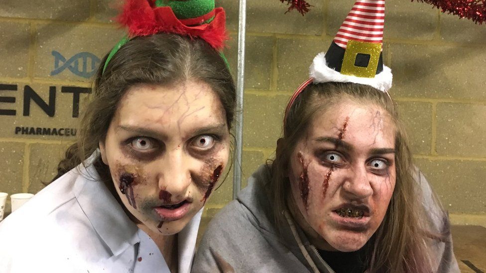 Charlie-Jo Woodford (right) and colleague as zombies