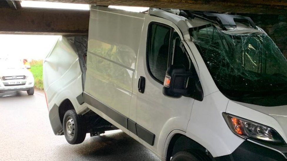 Van under bridge