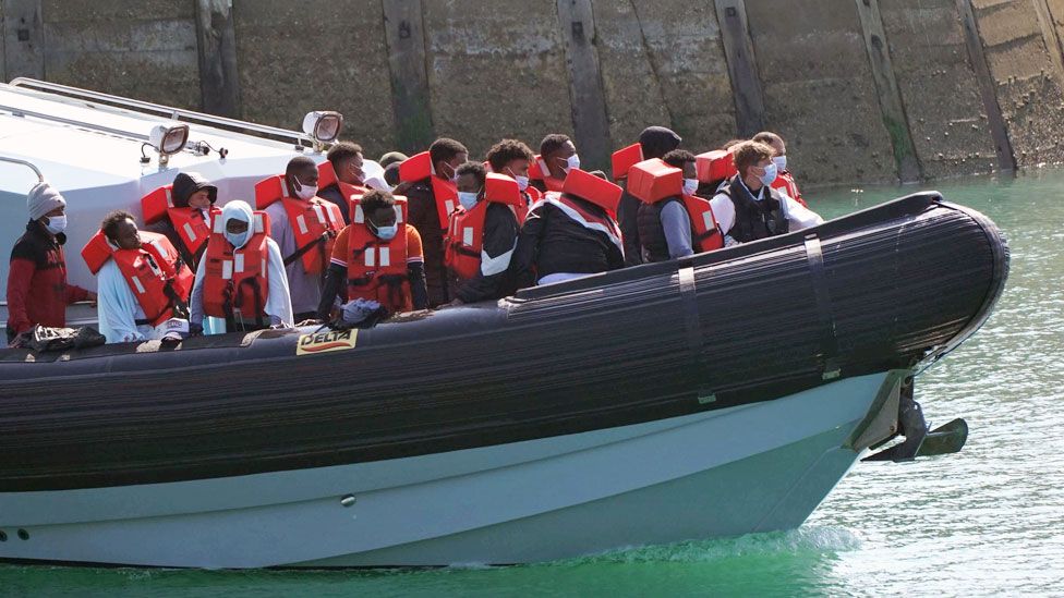 A group of people are brought in to Dover, Kent, by Border Force officers following a small boat incident in the Channel