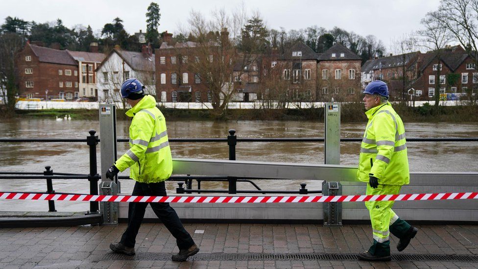 Workers from the Environment Agency install flood defences in Bewdley, Worcestershire