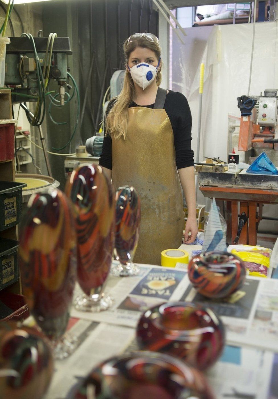 Woman in a workshop wearing a facemask