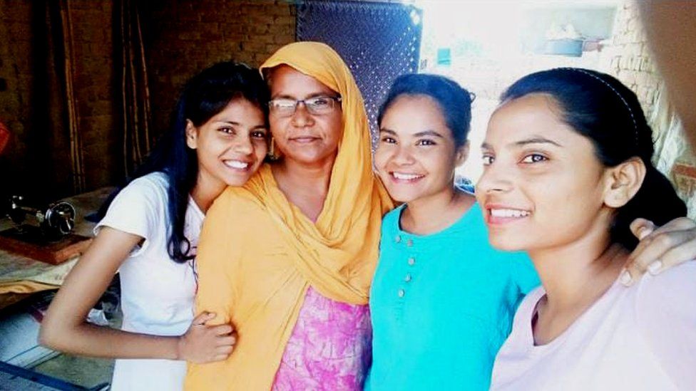 Nodeep Kaur with her mother and sisters