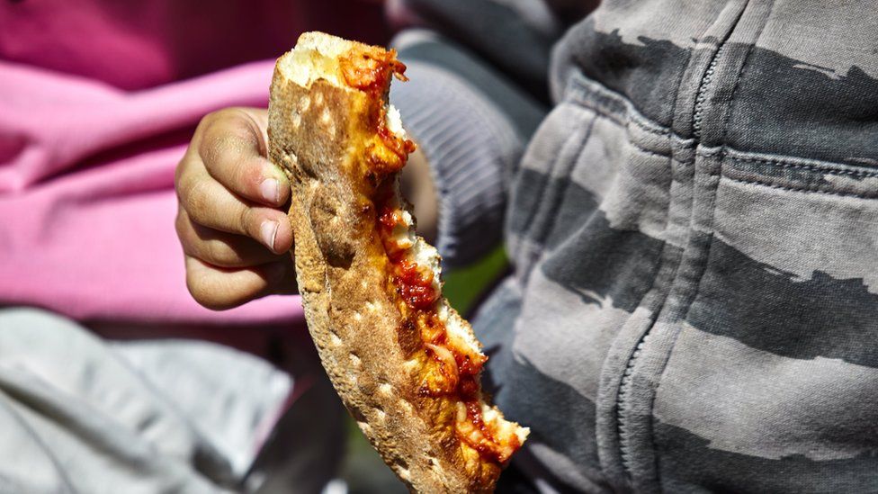 Child with pizza