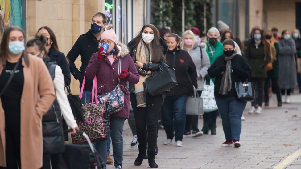 Shoppers queue for a Primark store on Black Friday on November 27, 2020 in Cardiff, Wales