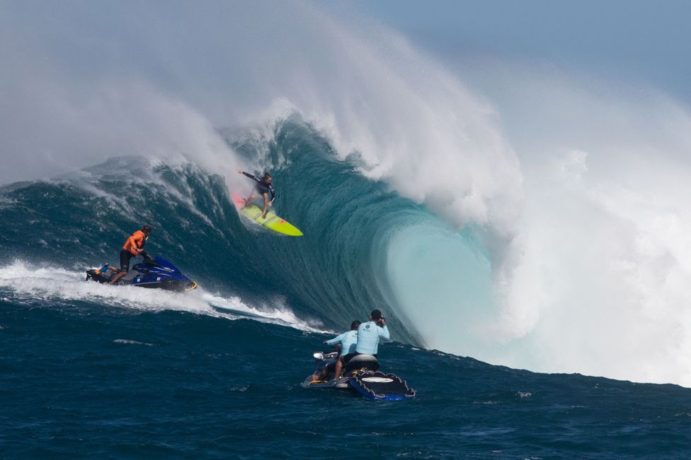 Hawaiian surfer Paige Alms surfs a big wave at Jaws, off the coast of the Maui Island in Hawaii to win the Peahi Challenge 2016, on November 11, 2016, the first-ever Women's Big Wave Tour event.