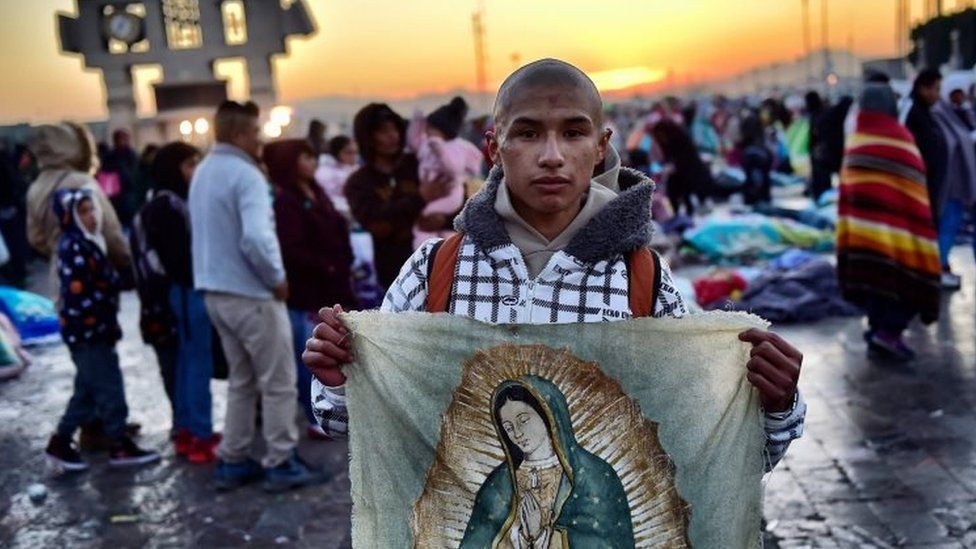 Catholic faithful holds a banner with an image of the Virgin of Guadalupe in Mexico City on December 12, 2017.