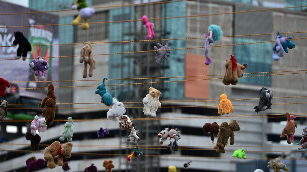 View of stuffed animal toys hanged from ropes in remembrance of murdered women, in the framework of the International Day for the Elimination of Violence against Women, in Tegucigalpa, on 25 November, 2019.