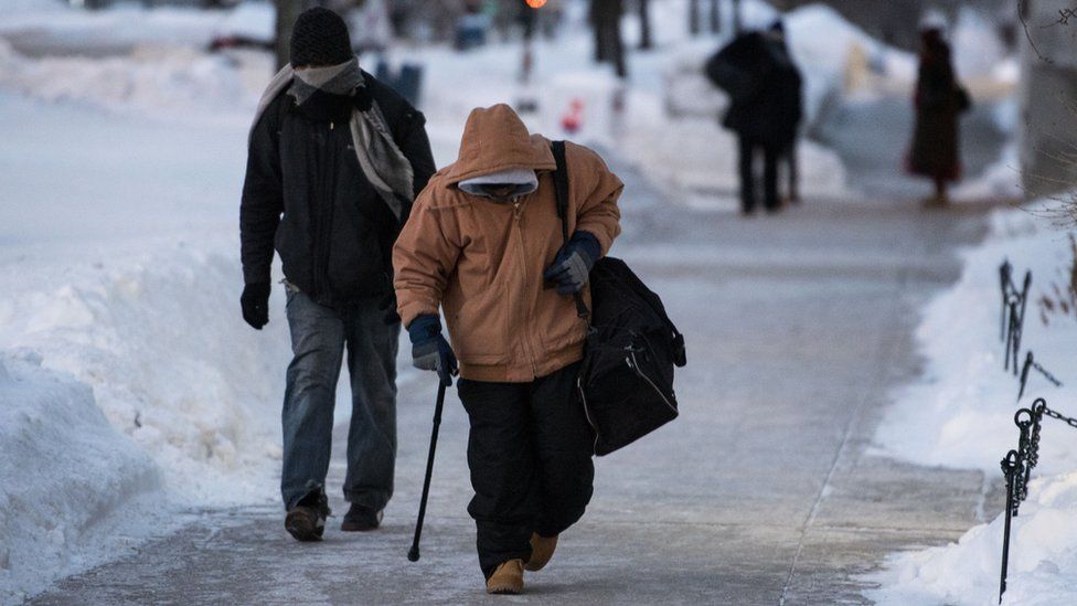 Men walking to a homeless shelter in Madison, Wisconsin