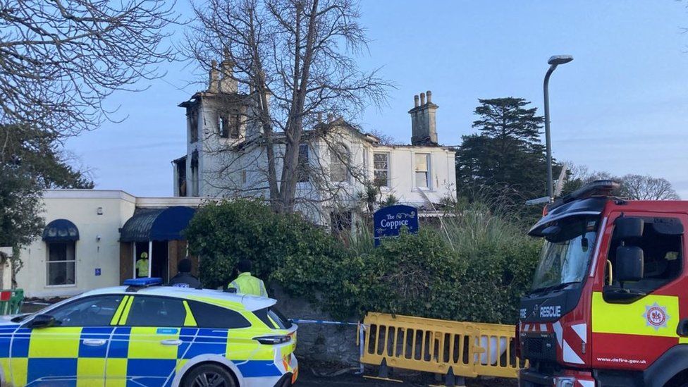 Firefighters and police at The Coppice following a blaze