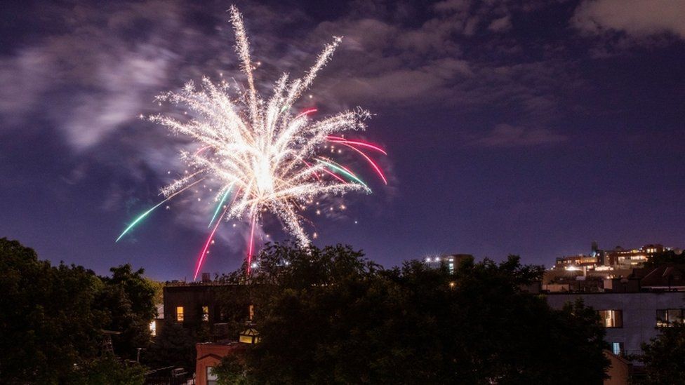 Illegal fireworks illuminate the sky over the Bedford-Stuyvesant neighbourhood of the Brooklyn borough of New York City on 19 June