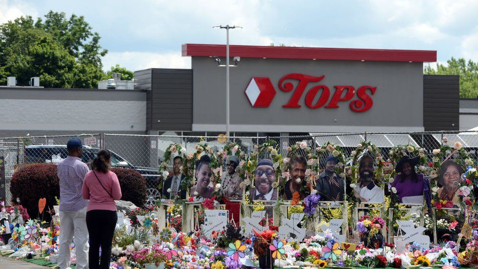 Community members pay respects outside the Tops Friendly Market in Buffalo, New York