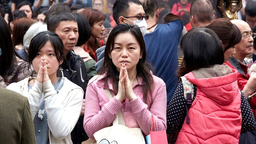 Worshippers at Longshan temple in Taiwan