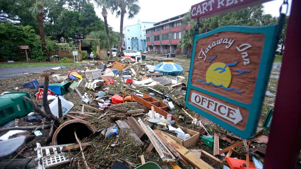 A street is blocked from debris washed up from the tidal surge of Hurricane Hermine Friday, 2 September 2016, in Cedar Key, Fla.