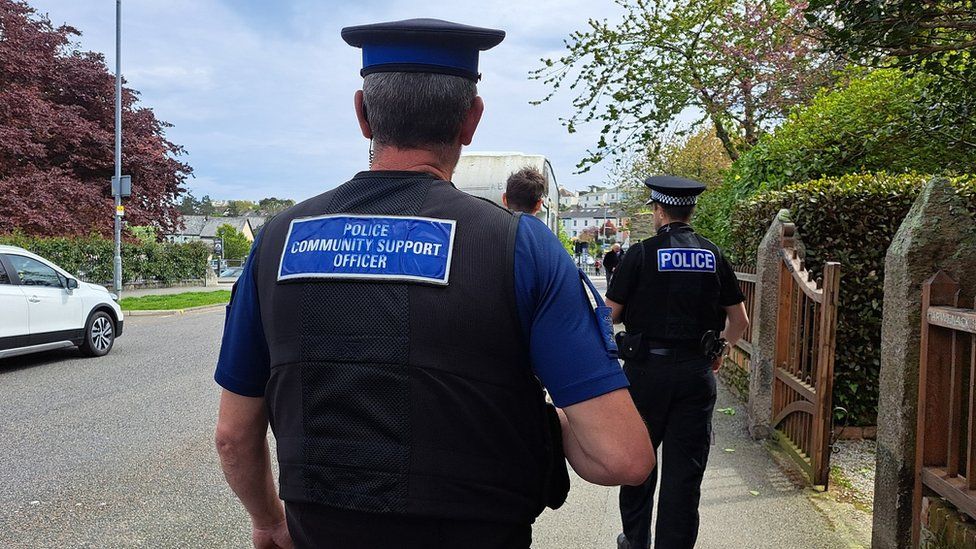 Devon and Cornwall Police staff walking on a pavement